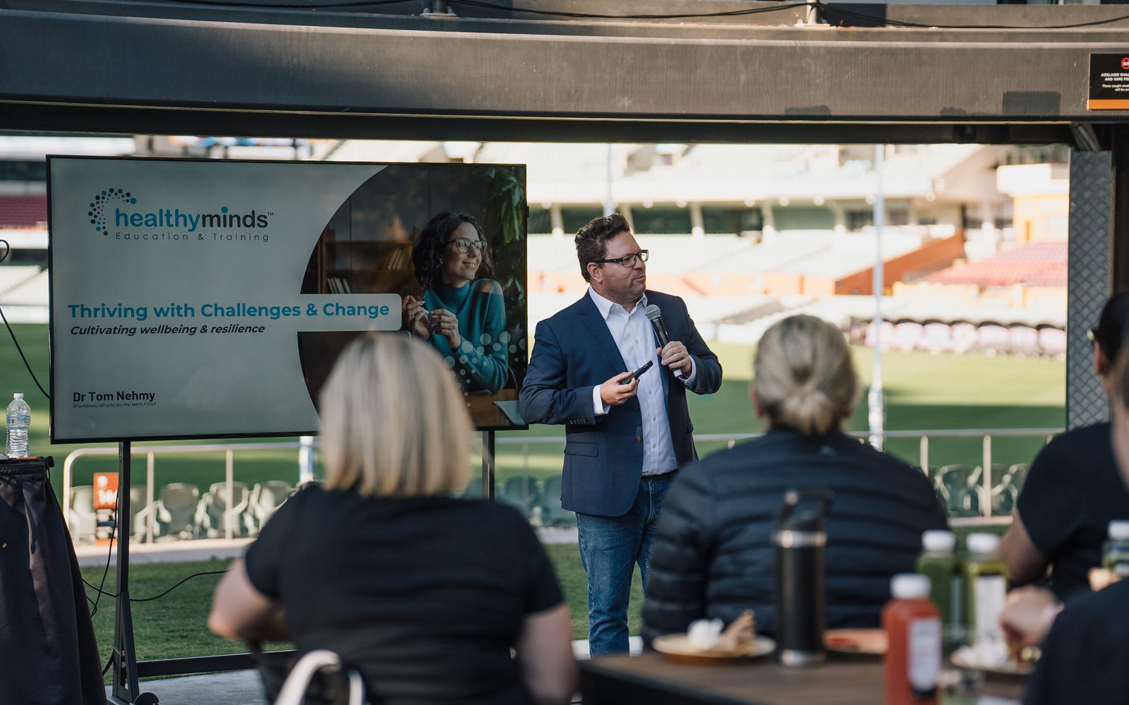 Tom Nehmy presenting a Healthy Minds session to a corporate audience at Adelaide Oval